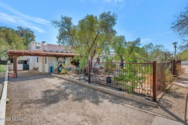 view of gate with fence