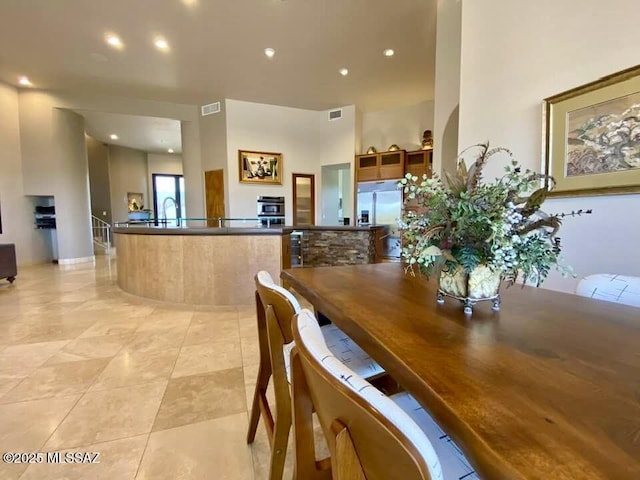 dining space featuring light tile patterned floors, visible vents, and recessed lighting