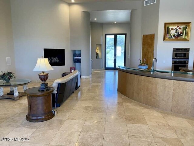 reception area featuring visible vents and a sink