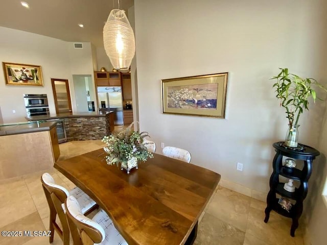 dining room featuring visible vents and light tile patterned floors