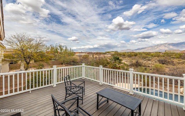 wooden terrace featuring a mountain view