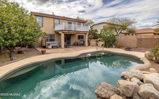 view of swimming pool with fence, a fenced in pool, and a patio area
