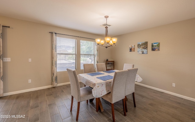 dining area featuring baseboards, dark wood-style flooring, visible vents, and an inviting chandelier