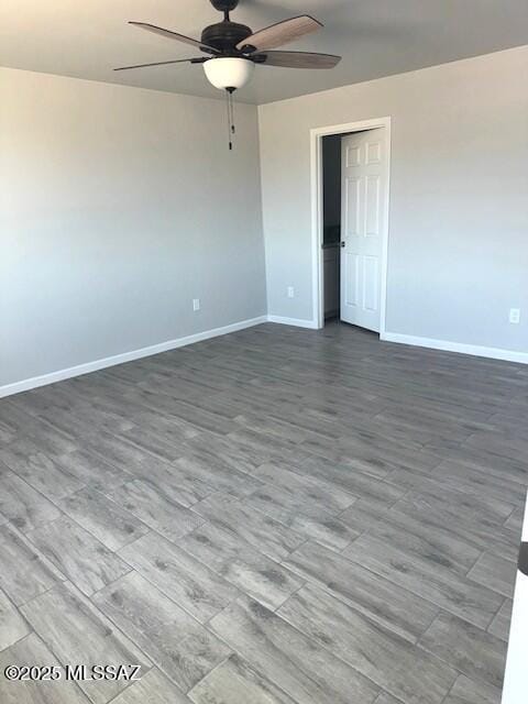 49 S Richmond Dr, Corona De Tucson, AZ 85641 - unfurnished room with baseboards, wood finished floors, and ceiling fan