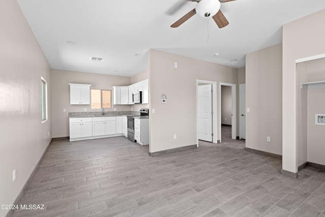 kitchen with light wood-style flooring, visible vents, stainless steel appliances, a ceiling fan, and white cabinetry