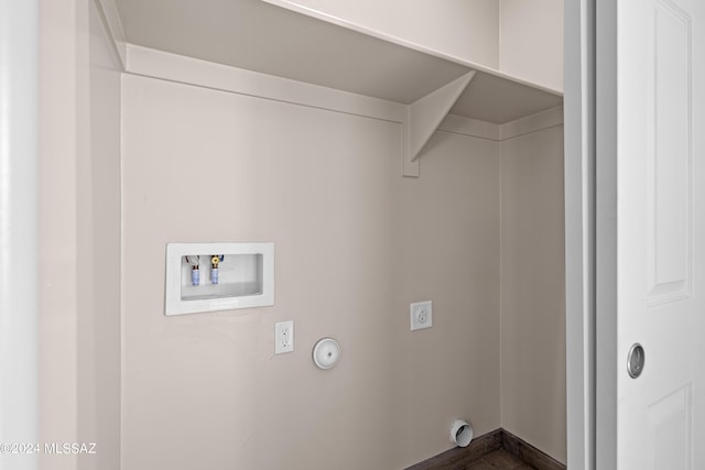 clothes washing area with washer hookup, hookup for an electric dryer, laundry area, and gas dryer hookup