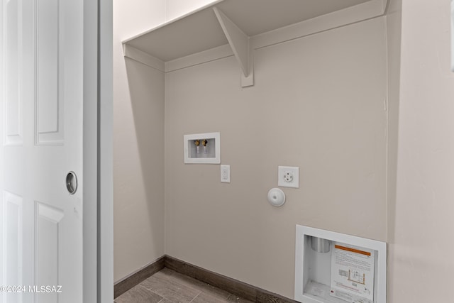 washroom featuring washer hookup, wood finished floors, electric dryer hookup, laundry area, and baseboards