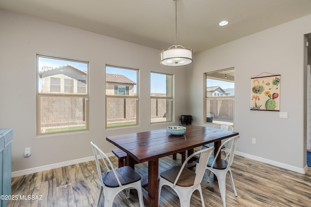 dining area with recessed lighting, baseboards, and light wood-style floors