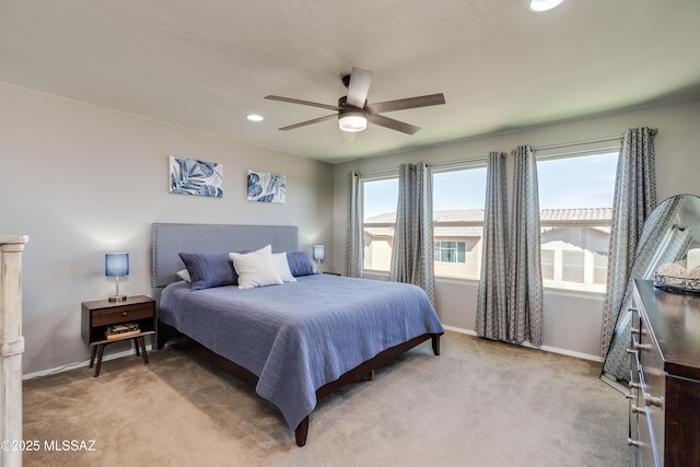 bedroom with recessed lighting, baseboards, and light colored carpet