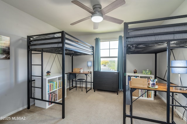bedroom featuring baseboards and carpet