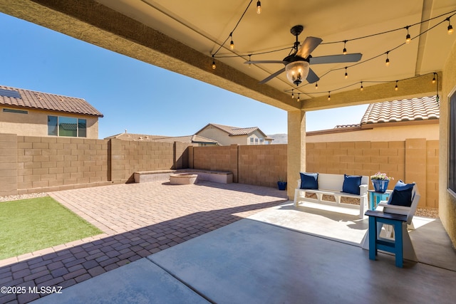 view of patio / terrace with a fenced backyard and ceiling fan