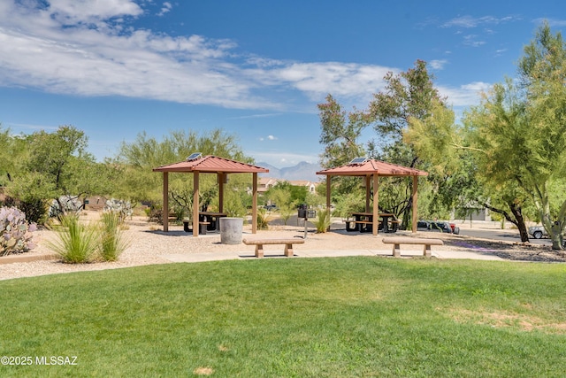 view of property's community with a gazebo and a lawn