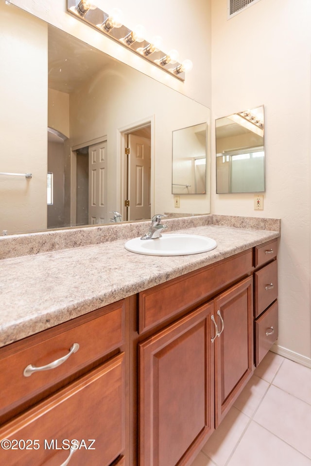 bathroom featuring tile patterned floors and vanity