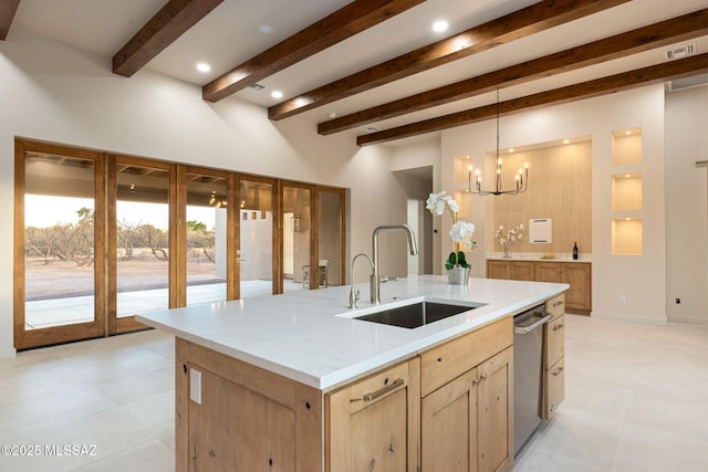 kitchen with stainless steel dishwasher, light brown cabinetry, beamed ceiling, a chandelier, and a sink