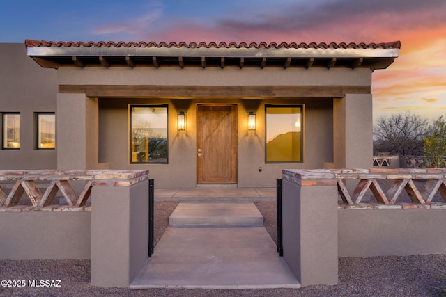 view of front of property with fence private yard and stucco siding