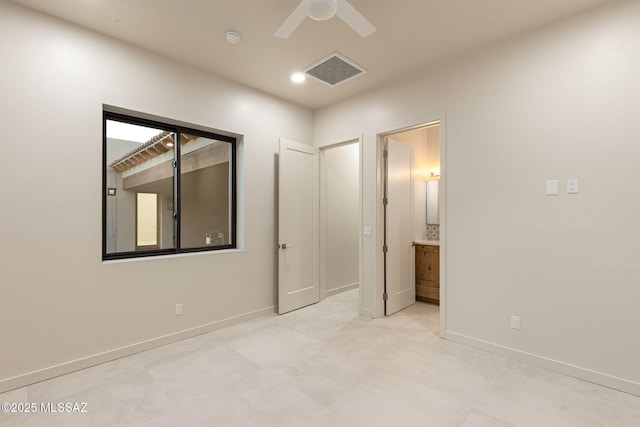 unfurnished bedroom with baseboards, ensuite bathroom, ceiling fan, and visible vents