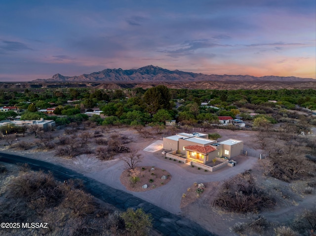 aerial view at dusk with a mountain view