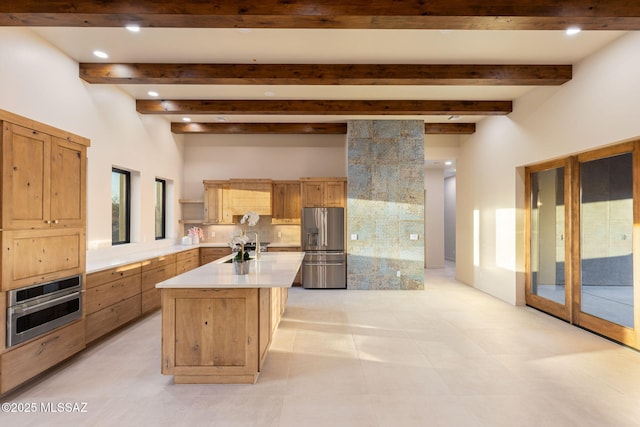 kitchen with light countertops, stainless steel appliances, recessed lighting, and tasteful backsplash