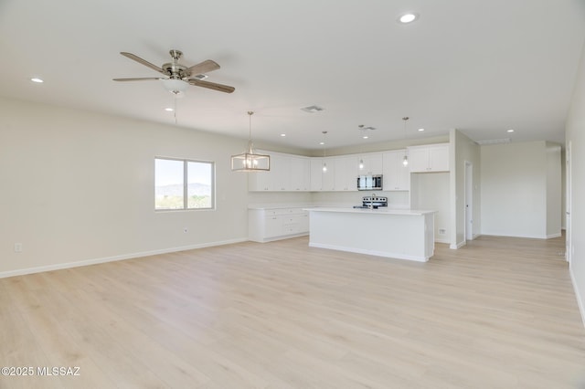 unfurnished living room with a ceiling fan, visible vents, light wood-type flooring, baseboards, and recessed lighting