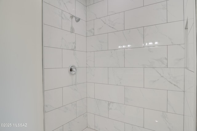 full bath with a tile shower