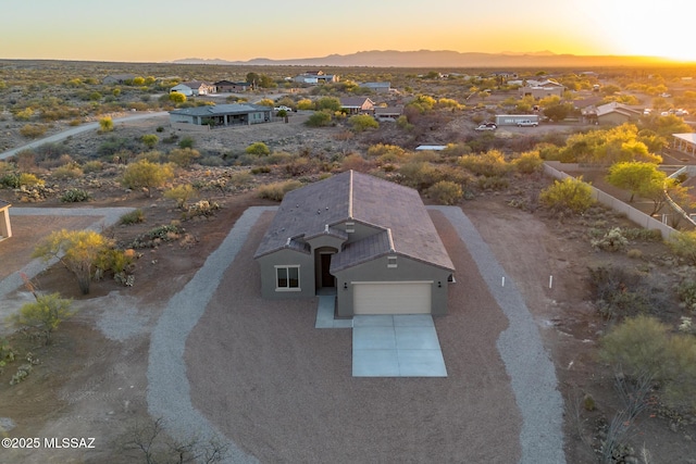 aerial view at dusk with a mountain view