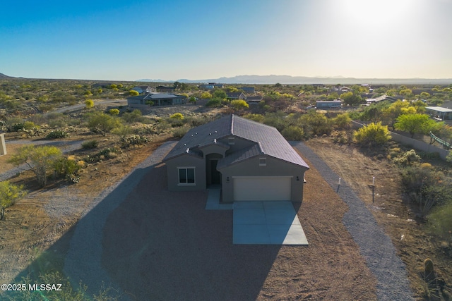 birds eye view of property with a mountain view