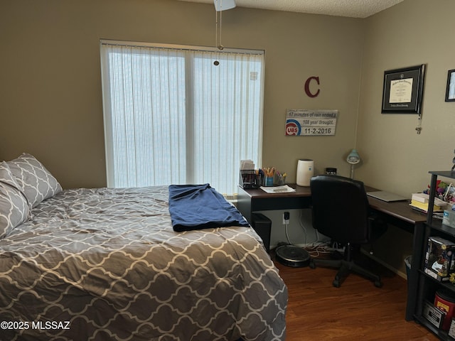 bedroom with wood finished floors