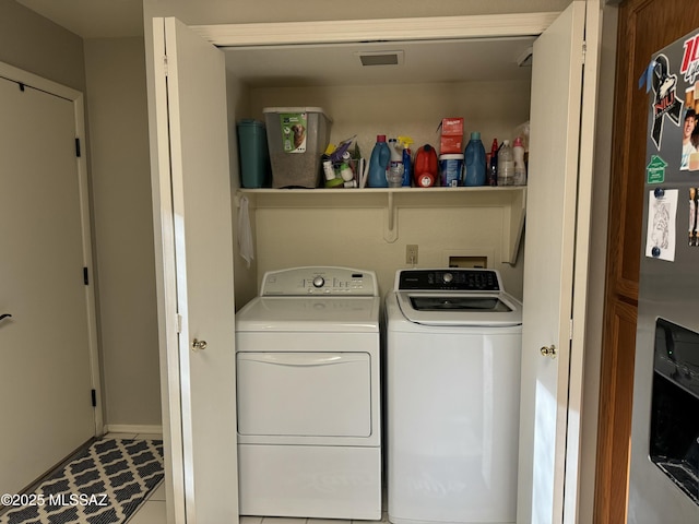 washroom with washer and dryer and laundry area