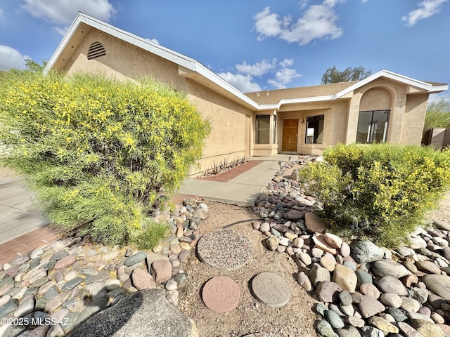 exterior space with stucco siding