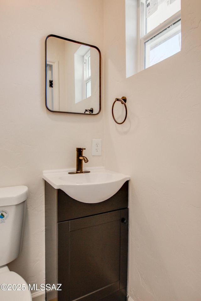 half bath with toilet and vanity