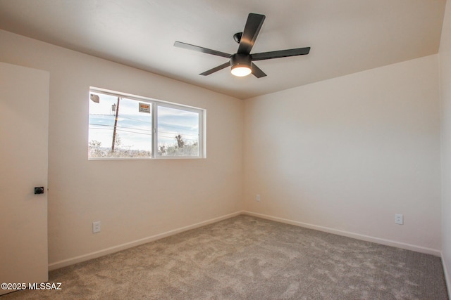 empty room with baseboards, carpet flooring, and a ceiling fan