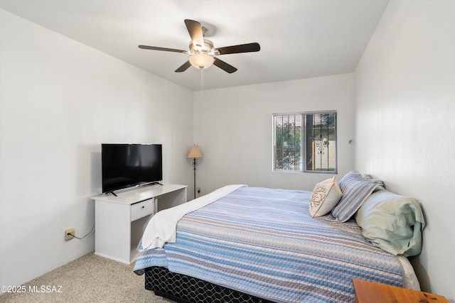 bedroom with light carpet and ceiling fan