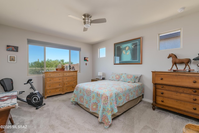 carpeted bedroom featuring baseboards and ceiling fan