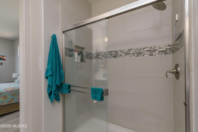 ensuite bathroom with a stall shower and connected bathroom