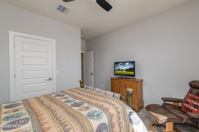 carpeted bedroom with visible vents and ceiling fan