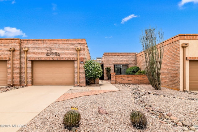 view of front facade with driveway and an attached garage