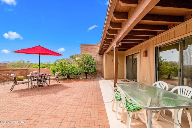 view of patio with outdoor dining area