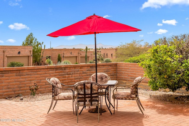 view of patio / terrace with a mountain view