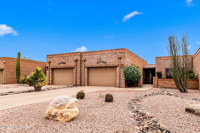 view of front of home with an attached garage and concrete driveway