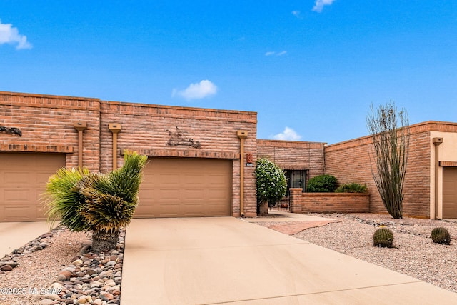 view of front of property featuring a garage and concrete driveway