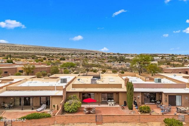back of property featuring outdoor dining space and a patio