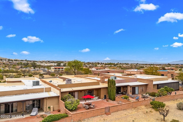 back of property featuring a patio and a mountain view