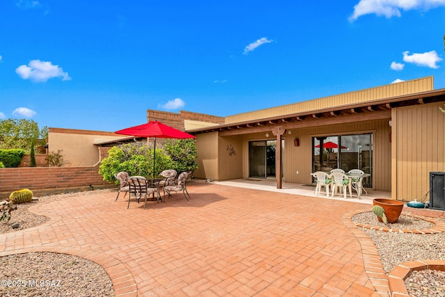 view of patio with outdoor dining area
