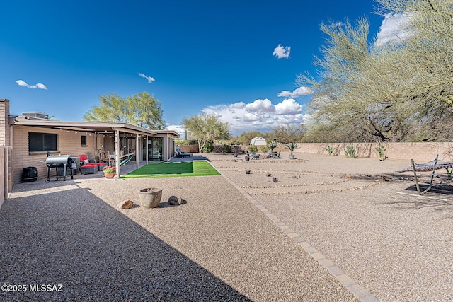 view of yard featuring a fenced backyard and a patio area