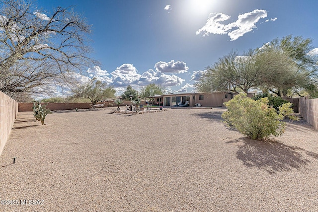 exterior space with a fenced backyard