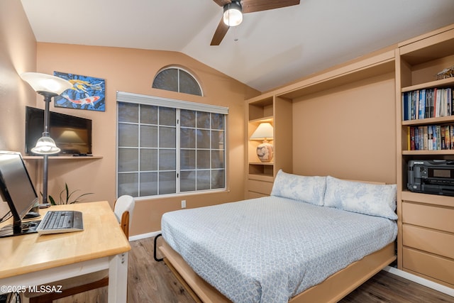 bedroom featuring vaulted ceiling, a ceiling fan, and wood finished floors