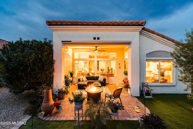 view of patio featuring an outdoor living space with a fire pit
