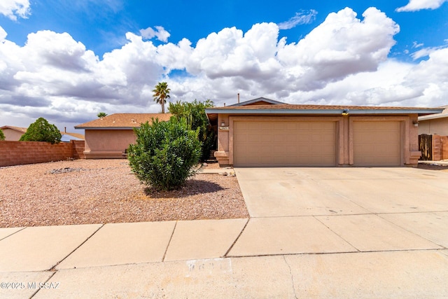 8691 N Huckelberry Way, Tucson, AZ 85742 - single story home featuring fence, stucco siding, concrete driveway, and an attached garage