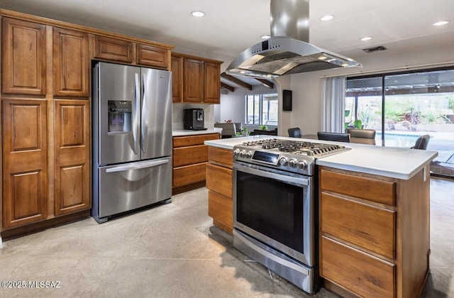 kitchen with stainless steel appliances, island range hood, light countertops, brown cabinetry, and recessed lighting