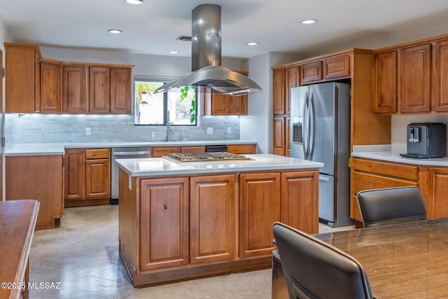 kitchen with appliances with stainless steel finishes, brown cabinets, backsplash, a center island, and recessed lighting